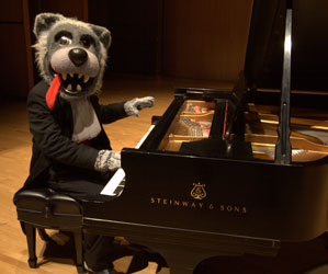 Photo of Music Lobo on piano. Link to Gifts from Retirement Plans